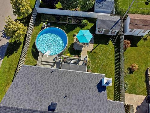 Backyard - 313 Rue Des Groseillers, Saint-Eustache, QC - Outdoor With Above Ground Pool