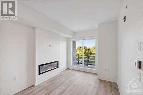 397 Codd'S Road Unit#211, Ottawa, ON - Indoor Photo Showing Living Room With Fireplace