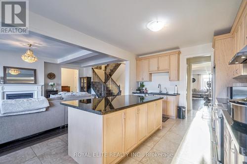 7 Goldeneye Drive, East Gwillimbury, ON - Indoor Photo Showing Kitchen With Fireplace