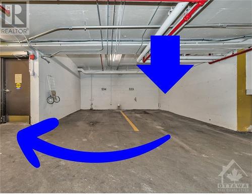 Parking Space is near to the entrance door. - 265 Poulin Avenue Unit#1501, Ottawa, ON - Indoor Photo Showing Garage