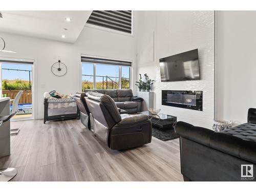 316 42 St Sw, Edmonton, AB - Indoor Photo Showing Living Room With Fireplace