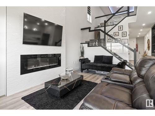 316 42 St Sw, Edmonton, AB - Indoor Photo Showing Living Room With Fireplace