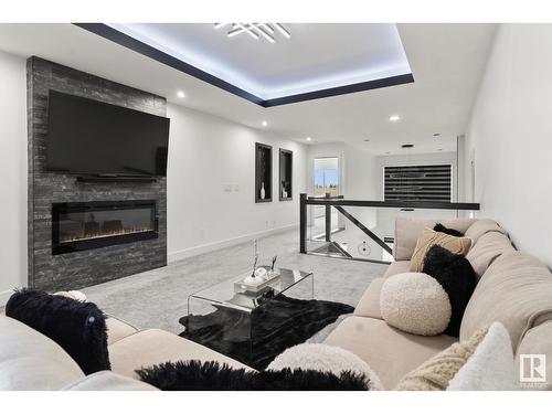 316 42 St Sw, Edmonton, AB - Indoor Photo Showing Living Room With Fireplace