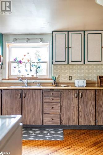 Kitchen with light hardwood / wood-style floors and sink - 1868 County Road 14, Ameliasburg, ON - Indoor Photo Showing Kitchen With Double Sink