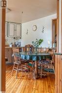 Dining area with hardwood / wood-style flooring - 