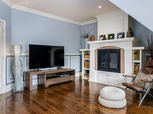 Family room - 35 Rue Des Liards, Blainville, QC - Indoor Photo Showing Living Room With Fireplace