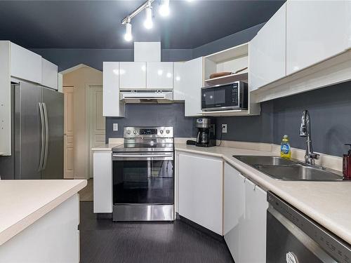 212-935 Johnson St, Victoria, BC - Indoor Photo Showing Kitchen With Stainless Steel Kitchen With Double Sink