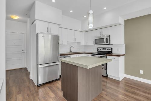 210-975 Academy Way, Kelowna, BC - Indoor Photo Showing Kitchen With Stainless Steel Kitchen With Upgraded Kitchen