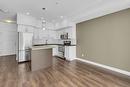 210-975 Academy Way, Kelowna, BC  - Indoor Photo Showing Kitchen With Stainless Steel Kitchen With Upgraded Kitchen 