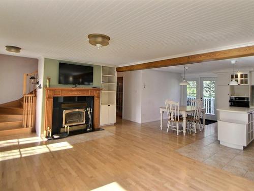 Vue d'ensemble - 4470 Ch. Lemerise, Amos, QC - Indoor Photo Showing Living Room With Fireplace