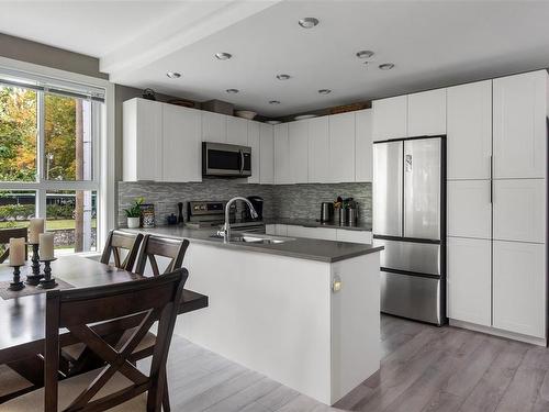 205-1460 Pandora Ave, Victoria, BC - Indoor Photo Showing Kitchen With Stainless Steel Kitchen