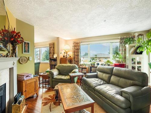 401-9975 Fifth St, Sidney, BC - Indoor Photo Showing Living Room With Fireplace