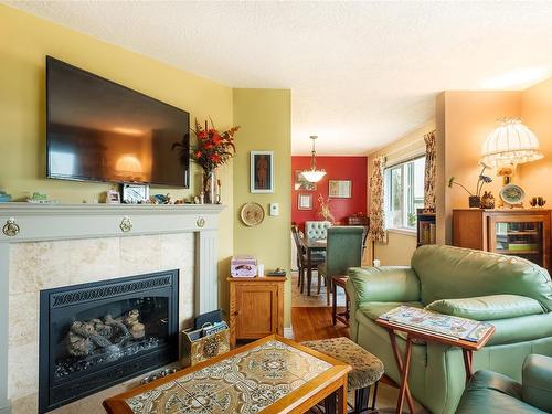 401-9975 Fifth St, Sidney, BC - Indoor Photo Showing Living Room With Fireplace