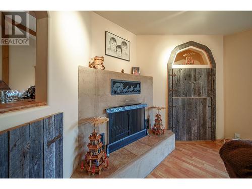 9109 Mackie Drive, Coldstream, BC - Indoor Photo Showing Other Room With Fireplace