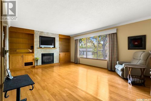 75 Krivel Crescent, Regina, SK - Indoor Photo Showing Living Room With Fireplace