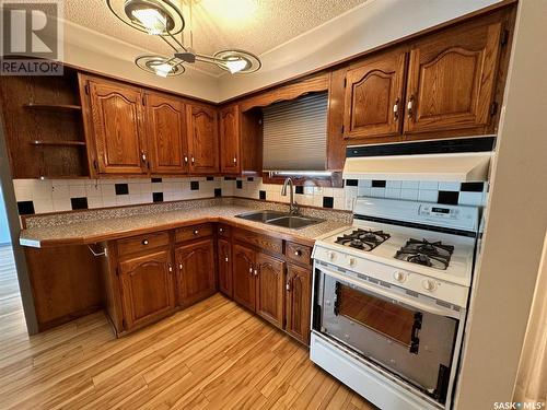 405 Churchill Street, Hudson Bay, SK - Indoor Photo Showing Kitchen With Double Sink