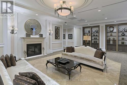 302 - 9245 Jane Street, Vaughan, ON - Indoor Photo Showing Living Room With Fireplace