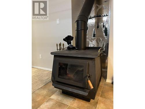 5615 Angus Court, Fort Nelson, BC - Indoor Photo Showing Other Room With Fireplace