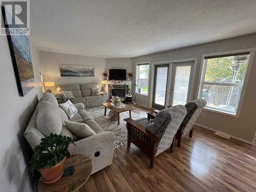 5615 Angus Court, Fort Nelson, BC - Indoor Photo Showing Living Room With Fireplace