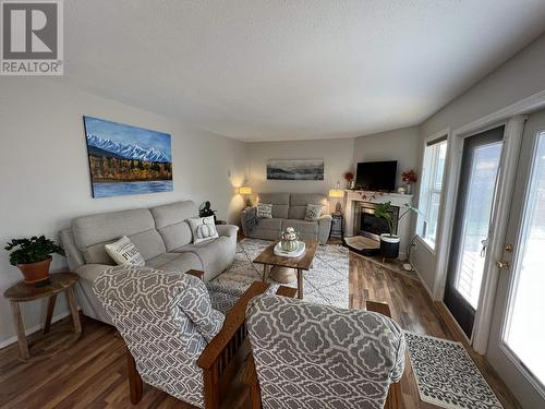 5615 Angus Court, Fort Nelson, BC - Indoor Photo Showing Living Room With Fireplace