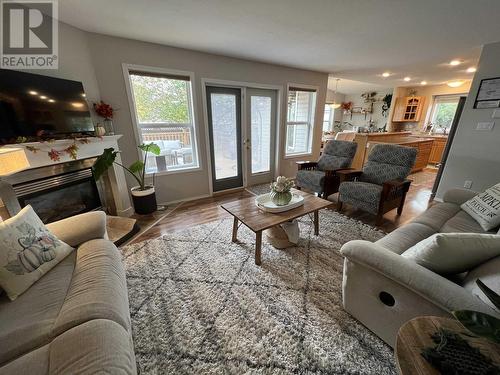 5615 Angus Court, Fort Nelson, BC - Indoor Photo Showing Living Room With Fireplace