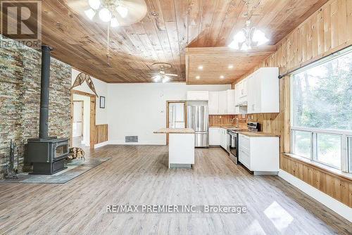 1153 Riding Ranch Road, South River, ON - Indoor Photo Showing Kitchen With Fireplace