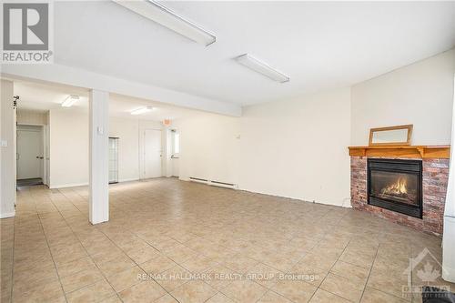 1229 Dwyer Hill Road, Ottawa, ON - Indoor Photo Showing Other Room With Fireplace