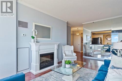 2514 - 100 Burloak Drive, Burlington, ON - Indoor Photo Showing Living Room With Fireplace