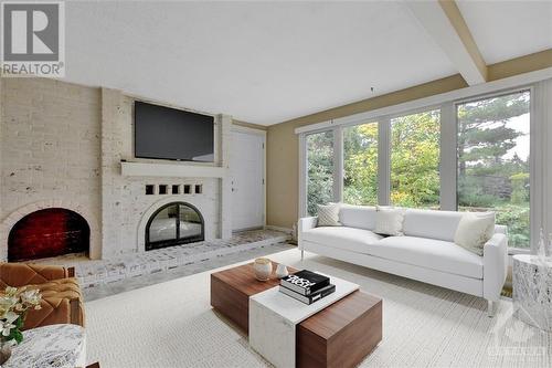 27 Dayton Crescent, Nepean, ON - Indoor Photo Showing Living Room With Fireplace