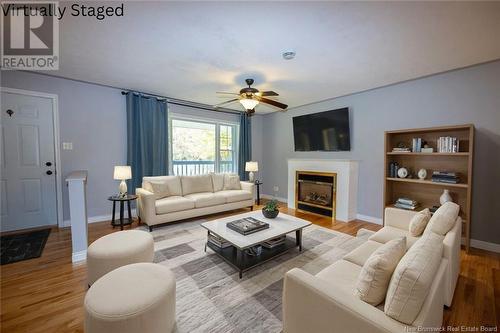 18 Courtney Street, Douglas, NB - Indoor Photo Showing Living Room With Fireplace