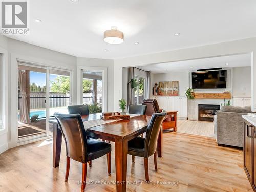 65 Dunrobin Drive, Haldimand, ON - Indoor Photo Showing Dining Room With Fireplace