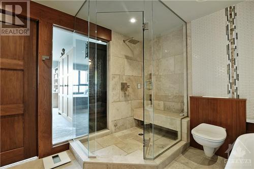 Bench seating in the shower allows for long lingering relaxing showers following a great work out in the Lower Level gym - 40 Boteler Street Unit#1102, Ottawa, ON - Indoor Photo Showing Bathroom