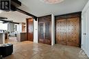 Exotic and unique detailing on the double entry doors accented with warm Limestone floor tiles - 40 Boteler Street Unit#1102, Ottawa, ON  - Indoor Photo Showing Other Room 