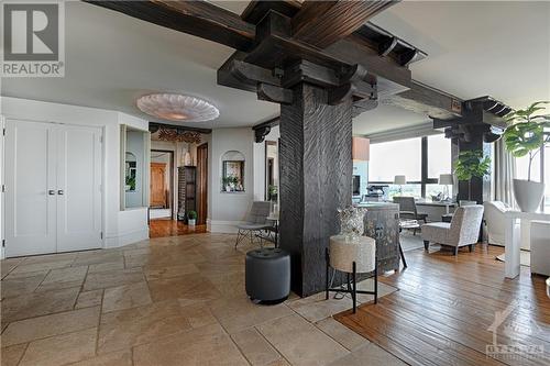 The heavily framed spaces boast arched wall relief accents and outstanding views. Light fixtures have a cloud like effect - 40 Boteler Street Unit#1102, Ottawa, ON - Indoor Photo Showing Other Room