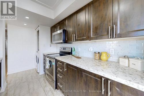 410 - 2550 Lawrence Avenue E, Toronto, ON - Indoor Photo Showing Kitchen With Upgraded Kitchen