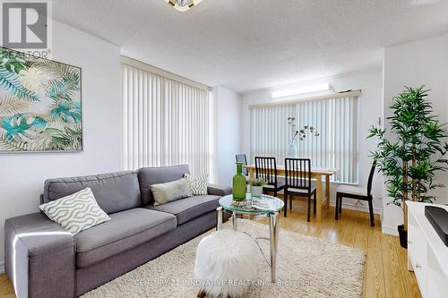 410 - 2550 Lawrence Avenue E, Toronto, ON - Indoor Photo Showing Living Room