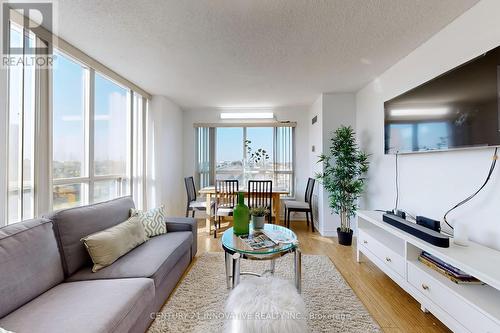 410 - 2550 Lawrence Avenue E, Toronto, ON - Indoor Photo Showing Living Room