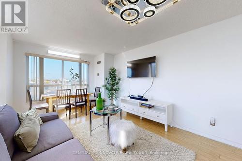 410 - 2550 Lawrence Avenue E, Toronto, ON - Indoor Photo Showing Living Room