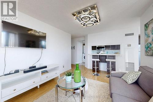 410 - 2550 Lawrence Avenue E, Toronto, ON - Indoor Photo Showing Living Room