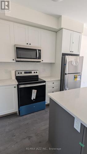 702 - 160 Densmore Road, Cobourg, ON - Indoor Photo Showing Kitchen With Stainless Steel Kitchen