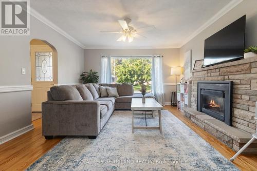 Lovely living room with large window - 191 Bethany Street, North Middlesex (Parkhill), ON - Indoor Photo Showing Living Room With Fireplace