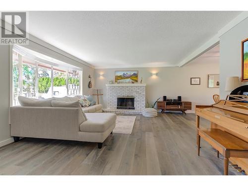 4531 Raymer Road, Kelowna, BC - Indoor Photo Showing Living Room With Fireplace