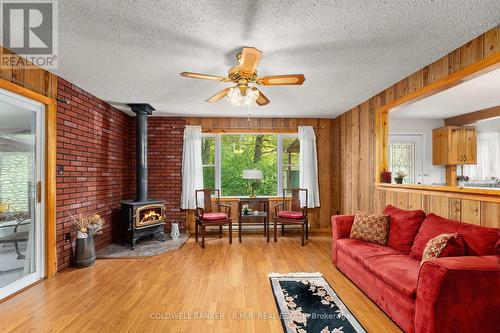 57 Fire Route 104, Galway-Cavendish And Harvey, ON - Indoor Photo Showing Living Room With Fireplace