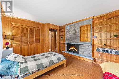 57 Fire Route 104, Galway-Cavendish And Harvey, ON - Indoor Photo Showing Bedroom With Fireplace