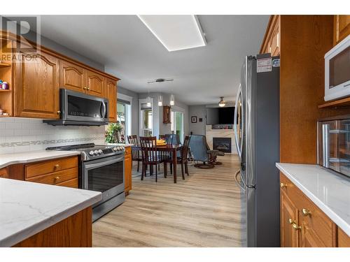 307 Sumac Road E, Kelowna, BC - Indoor Photo Showing Kitchen With Fireplace