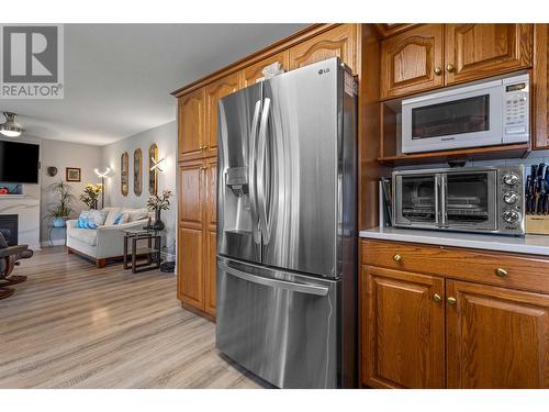 307 Sumac Road E, Kelowna, BC - Indoor Photo Showing Other Room With Fireplace