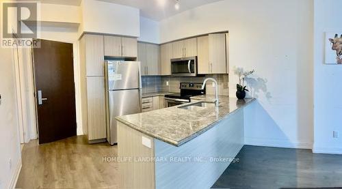 706 - 65 Speers Road, Oakville, ON - Indoor Photo Showing Kitchen With Upgraded Kitchen