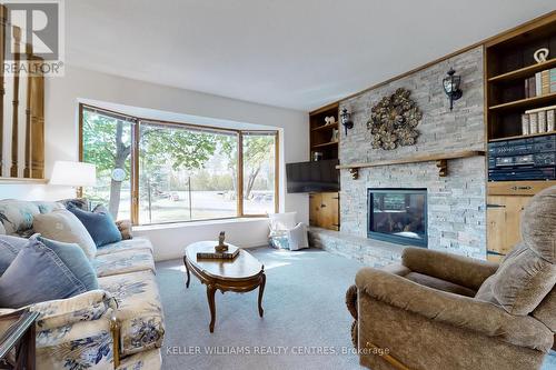 25985 Woodbine Avenue, Georgina, ON - Indoor Photo Showing Living Room With Fireplace