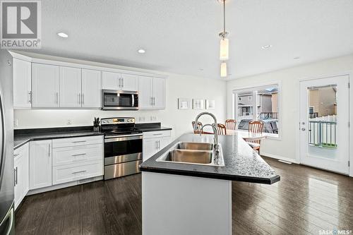 5109 Aerial Crescent, Regina, SK - Indoor Photo Showing Kitchen With Stainless Steel Kitchen With Double Sink With Upgraded Kitchen