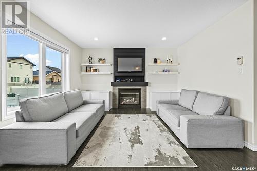 5109 Aerial Crescent, Regina, SK - Indoor Photo Showing Living Room With Fireplace